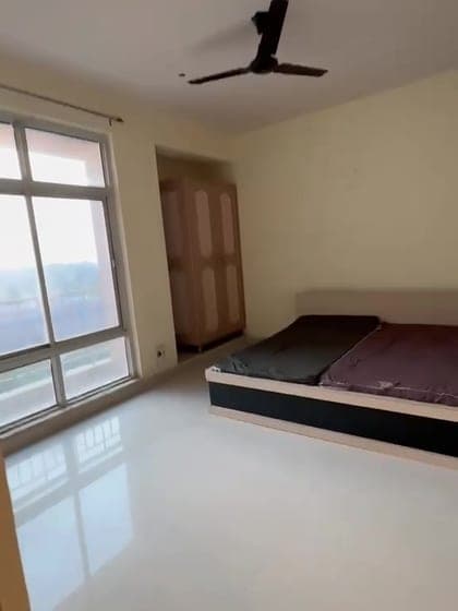 Bedroom with wardrobe and window